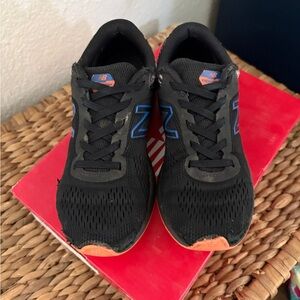 New Balance Black Sneakers with Blue and Orange Accents